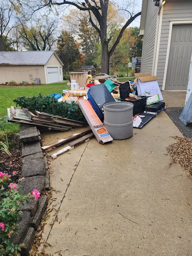 Dumpster being loaded with debris for Residential Dumpster Rental in Avon